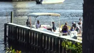 Watching a pontoon pull in to the boat ramp at Sunset Beach, NC