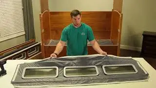Installing the padding around the safety rail windows of a SleepSafe Bed.