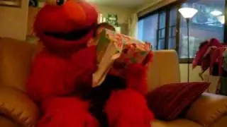 Sea opens presents with Elmo