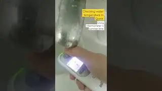 Checking water temperature in Qatar using thermometer on summer time. #shorts