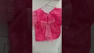 kids blouse having double frills design on the sleeves and bow on the backside and zip in the side