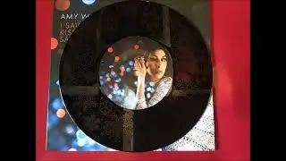 Amy Winehouse ~ I Saw Mommy Kissing Santa Claus