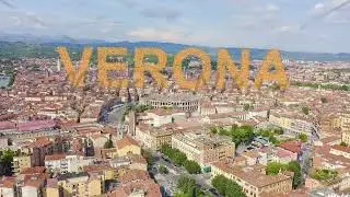 Inscription on video. Verona, Italy. Flying over the historic city center. Arena di Verona, summer.