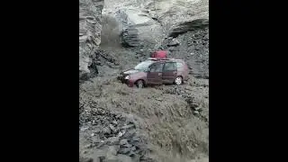 India: A car was stuck due to heavy water fall ! Caught on the Camera !