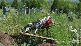 Exhumation of remains of soldiers who died in 2014 near the Russian frontier - 18+