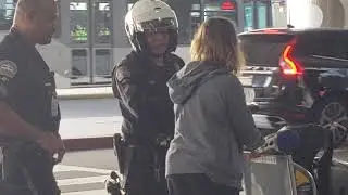 LAX   Airport police giving out a Jaywalking ticket at lax