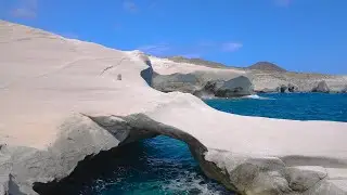 4K White Chalk Cliffs and Natural Arch of Sarakiniko Beach on Milos island, Greece