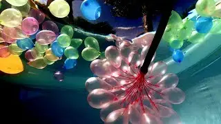Filling Water Balloons Underwater in a Swimming Pool