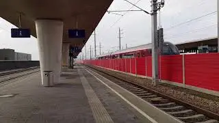 Railjet mit Hochgeschwindigkeit durch den Bahnhof Tullnerfeld