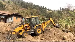 JCB Backhoe 3DX Machine Working On A Farm In A Remote Hilly Village Area