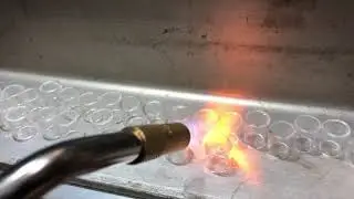 Flame polishing the ends of some glass IH inserts for the Flux Deluxe