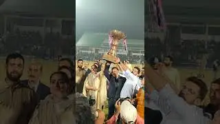 The Trophy🏆 of Red premier league in front of Crowd