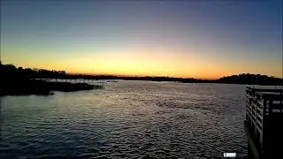 A Calm Sunset Over Reflective Water Reminding Everyone To Just Pause And Breathe Tonight