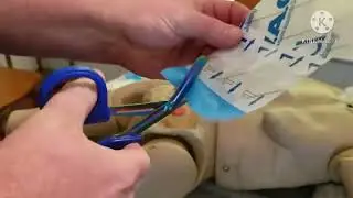 Dressing a wound with something impaled in it