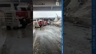 Driver saved by bystander after semi-truck crashes through overpass, falls to road below