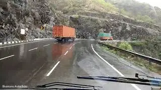 Konduskar Travels Volvo B7R climbing Khambataki Ghat section on a rainy afternoon with captain Irfan