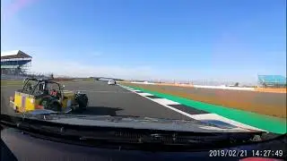 Caterham overtaking in a corner at Silverstone