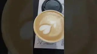 Drinking cappuccino in  shaina  Cafe