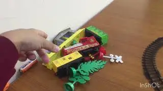 Train track play set toy with small railway station and 3 trees