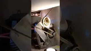 Reaching in and installing belt on pulley and motor for dryer￼
