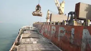 Bulk cargo discharging from mother vessel to lighter vessel at Chittagong outer anchor.
