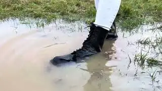 Dr Martens boots get wet exploring puddles in a field