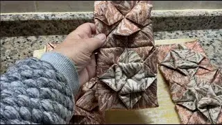 Three-dimensional blocks or origami made of fabric.