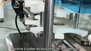 Machine de capsulage et de scellage enti&egrave;rement automa,adapt&eacute;e &agrave; divers types de bo&icirc;tes en plastique