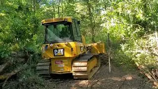 D4 Cat Dozer. Cutting a driveway into the property! Day one! Part 1.