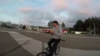 Solving the Rubik's cube blindfolded while riding BMX backwards