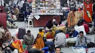 Hundreds stranded at New Delhi railway station as dense fog delays trains