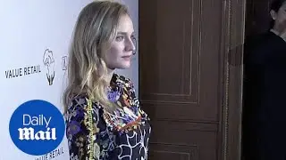 Diane Kruger holds her bag like a briefcase at charity event - Daily Mail