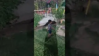 Both the brothers enjoying in the garden