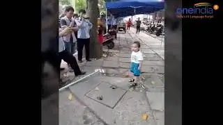 BAMBINO CINESE MINACCIA GLI AGENTI CHE VOGLIONO SGOMBERARE  LA SUA FAMIGLIA