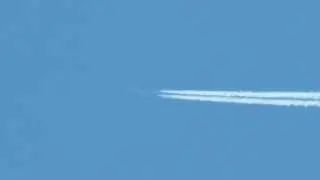 Airplane at long distance with contrails / air trails / vapour trails on October 2, 2013