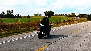 Motorcycle accelerates to intentionally buzz past cyclist at very high speed