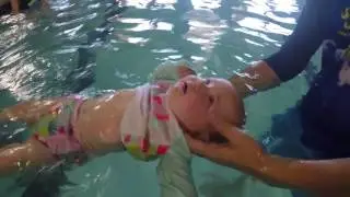 Baby learns how to float on back