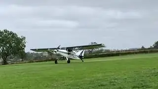 Maule M7 STOL bush plane short take-off from farm strip.