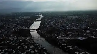Kutaisi city divided in two parts by long river flowing there filmed by drone