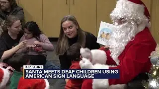 Santa meets deaf or hard of hearing children using American Sign Language