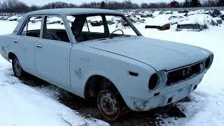A completely rusted 1965 Toyota Corona