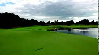 golf course with sand and water features by aerial drone