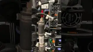 Back side of a Lenovo Neptune liquid cooling system. Manifold runs water to and from the chassis.