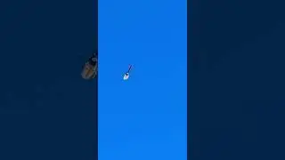 Red White & Blue Helicopter 🚁 flying in the sky  on a clear day