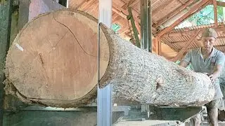 sawing teak wood planks full of old and beautiful grain