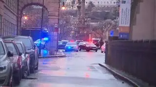 Police seek a motive as Prague mourns the 14 people killed in the nation's worst mass shooting