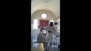 Diligently Cleaning church pew