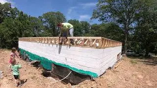 Installing Floor Trusses and building the basement walls