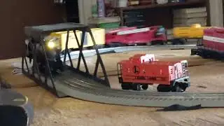 Our Pennsylvania flyer engine with race car freight train. 01/31/26 New layout table.