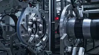 Robotic Tyre Manufacturing Equipment Rotating with Rubber Tape at Auto Plant